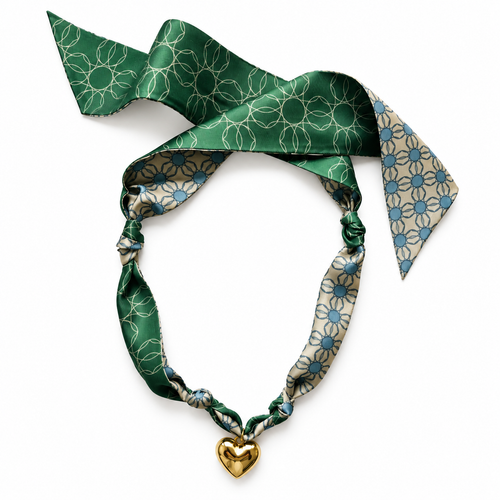 The Alma silk scarf necklace in green and blue geometric circle print with gold heart pendant
