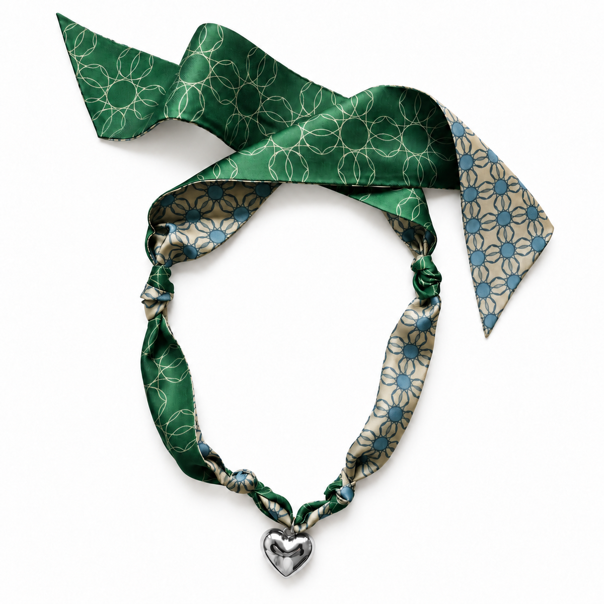 The Alma silk scarf necklace in green and blue geometric circle print with silver heart pendant