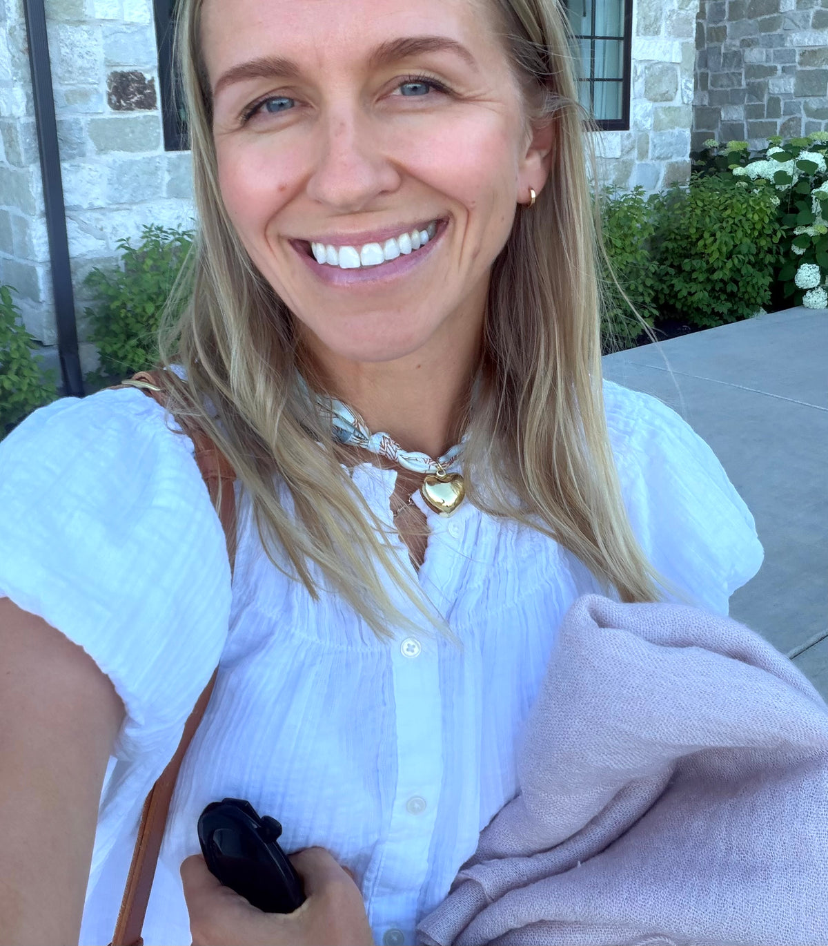 Woman wearing The Audrey silk-blend scarf necklace with a white button down blouse