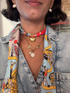 Woman wearing The Caroline silk scarf necklace with a denim button-down shirt