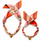 The Gigi scarf necklace in original and small sizes, side by side, with gold heart pendant