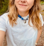Woman wearing The Jojo silk-blend scarf necklace with a classic white tee