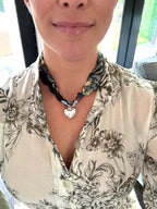 Woman wearing The Nicole silk scarf necklace with a white print button-down