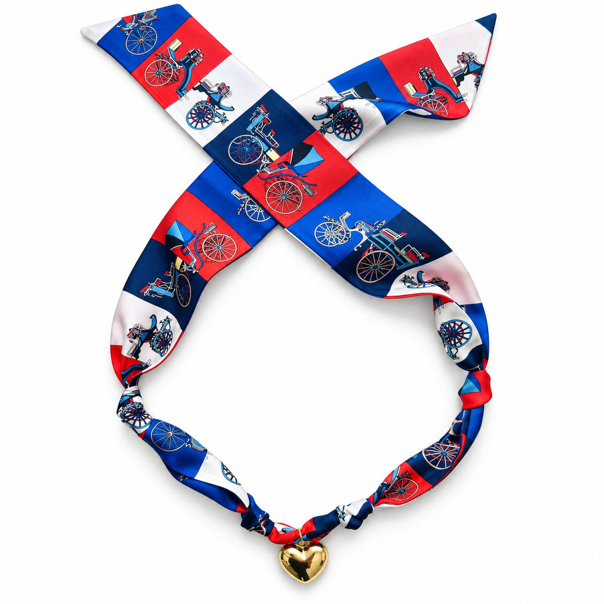 The Penny silk scarf necklace in red, blue, and white print with gold heart pendant