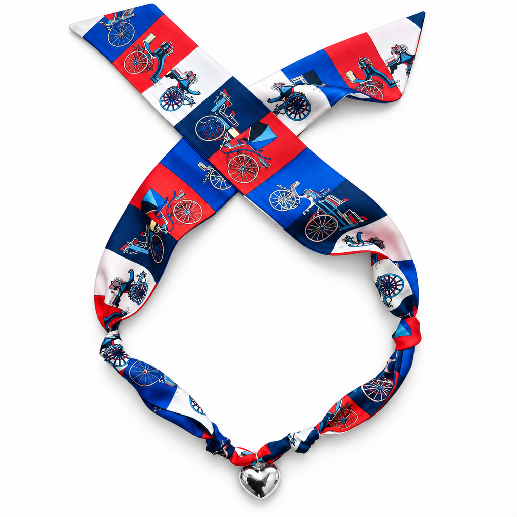 The Penny silk scarf necklace in red, blue, and white print with silver heart pendant