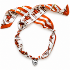 The Kreuger silk scarf necklace in burnt orange with silver heart pendant